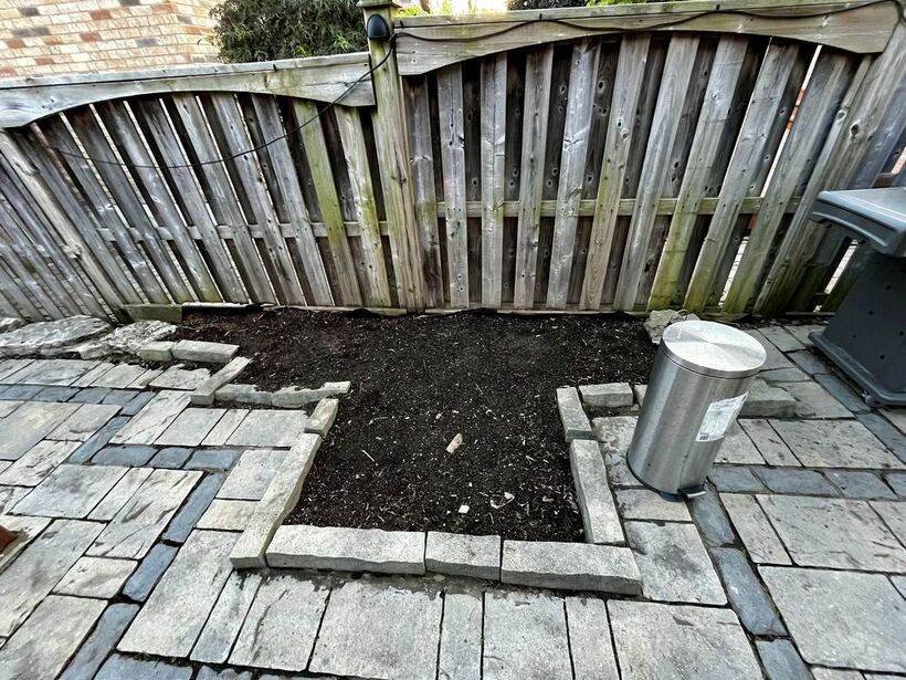Cleared and edged garden bed after landscaping